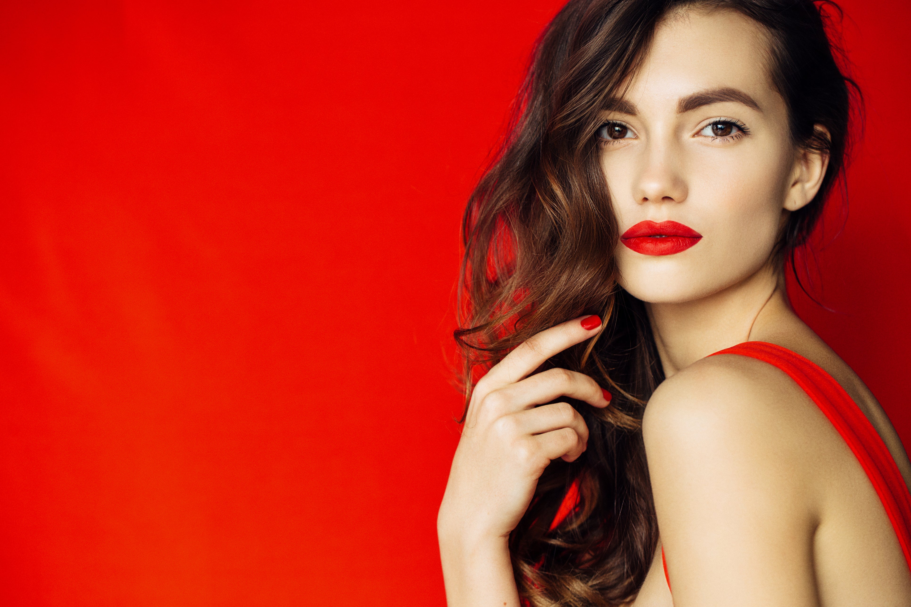 Turn Heads with These Best Lipstick Colors for a Red Dress